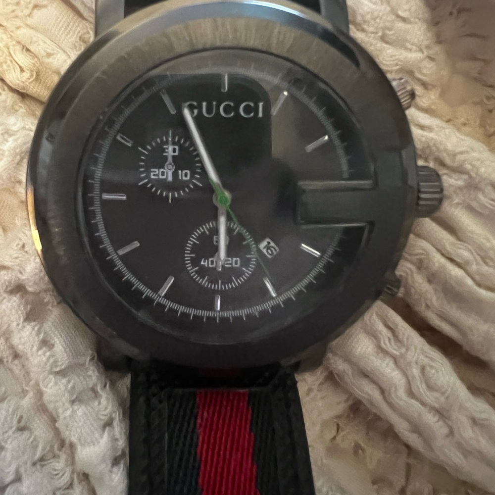 Copy Black Watch with Red and Green Strap. Needs battery. Super cute